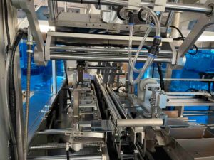 UBL cartoning machine production line internal mechanical system - Integrated conveyor & pneumatic components, built for efficient automated packaging processes in manufacturing facilities