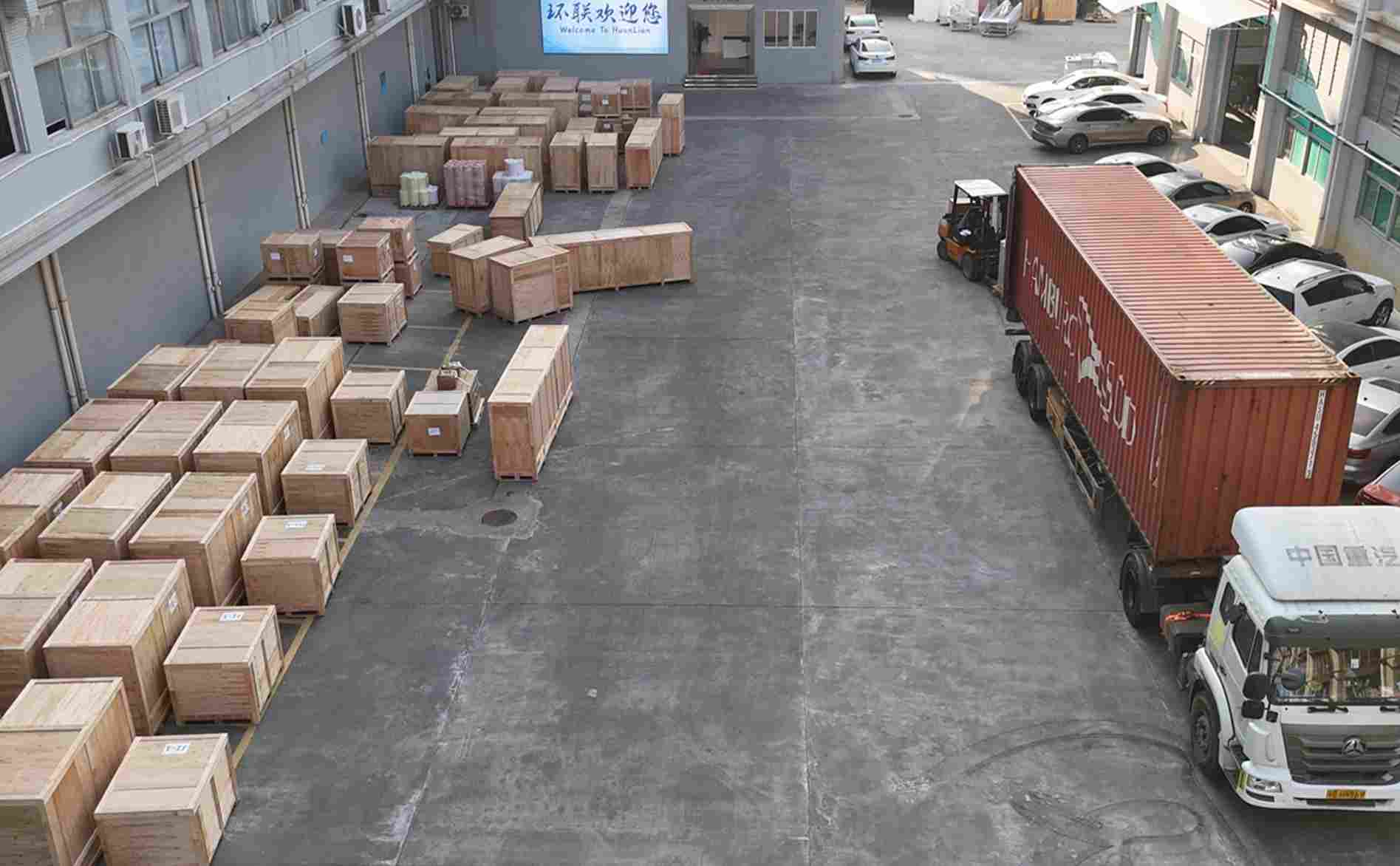 UBL’s equipment shipping preparation area: A large quantity of wooden-crated industrial equipment is neatly arranged here, and a container truck (with a forklift on standby) has been positioned on-site, fully ready for cargo loading and shipment