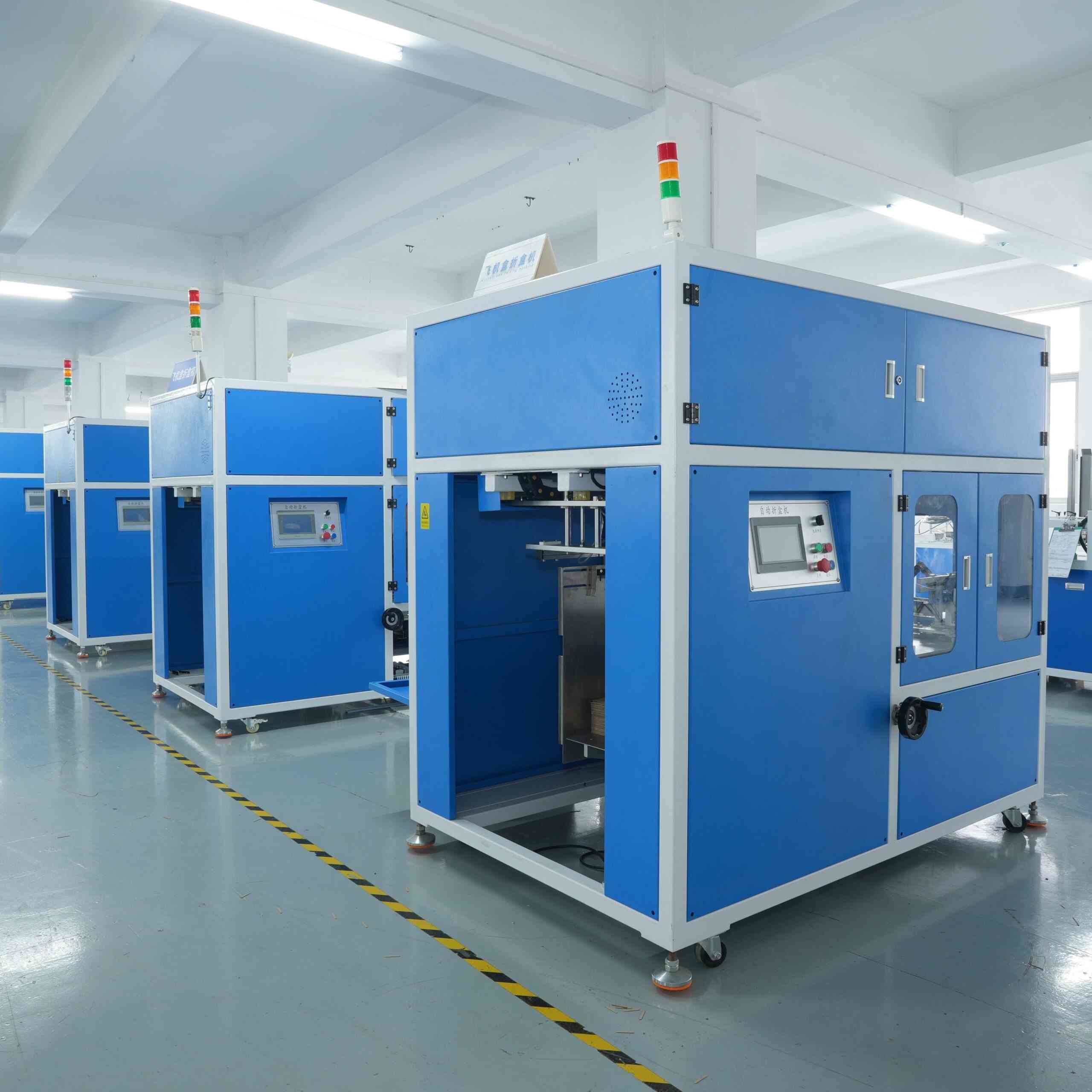 Blue Automatic Carton Folding Machine in Factory Workshop – High-precision Packaging Equipment for Carton Forming, Equipped with Touch Screen Control and Safety Interlocking System, Suitable for E-commerce, Cosmetics, and Food Industries