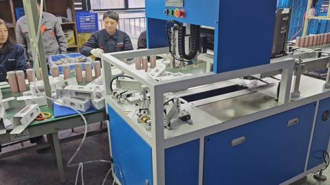 Factory production line: UBL carton folding machine outputs boxes for manual product loading, a practical application of Packaging Automation to optimize packaging workflow efficiency