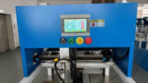 The Snap Lock Bottom box erector features a blue control panel equipped with a touchscreen for displaying operating parameters, along with power, start, reset, and emergency-stop buttons, as well as safety warning indicators. This design enables intelligent and precise machine control, ensuring a highly efficient and stable box-forming process.