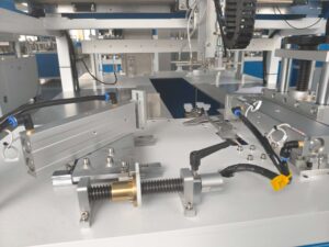 Internal structure of UBL carton folding machine – close-up view showing robotic arm components and their operational mechanism for precise carton folding