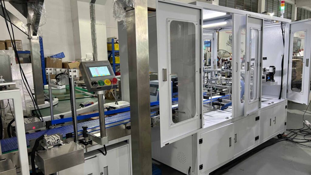 High-speed e commerce packaging machine for order fulfillment, featuring automated conveying and packaging functions in a production environment