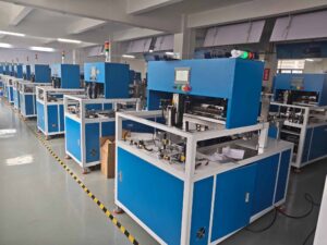 Lineup of UBL carton folding machines in production facility – demonstrating the large inventory and manufacturing scale of our automated packaging equipment