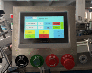 PLC control panel of a UBL cartoning machine, showing the touch interface and operational controls for automated cartoning processes.
