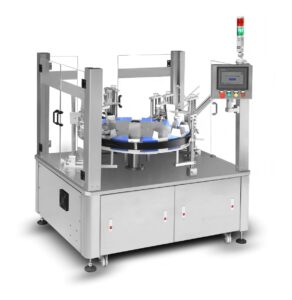 Full view of vertical packaging machine - rotating platform, safety enclosure, and touchscreen control panel for automated packaging operations