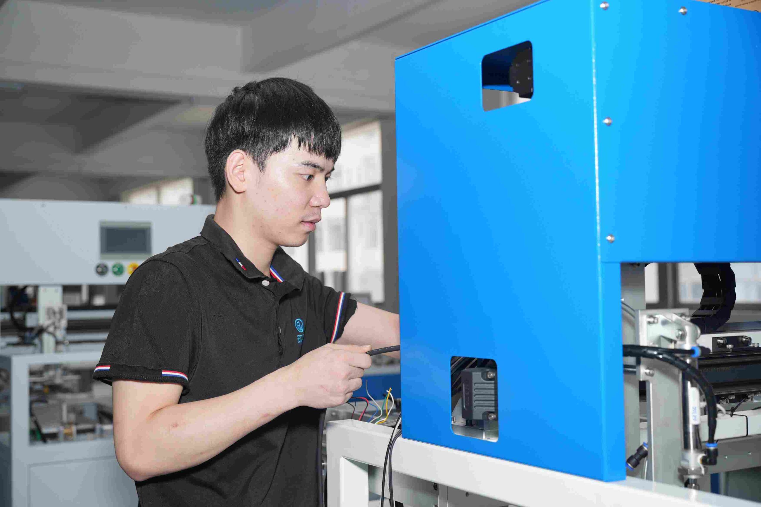 A technician is repairing a Folder Gluer machine, ensuring its stable operation for high-quality box folding and gluing.