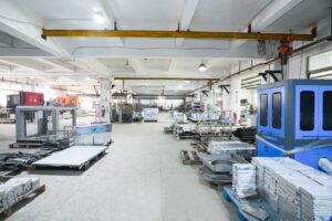 UBL integrated sheet metal production workshop featuring heavy-duty industrial cranes and organized material zones