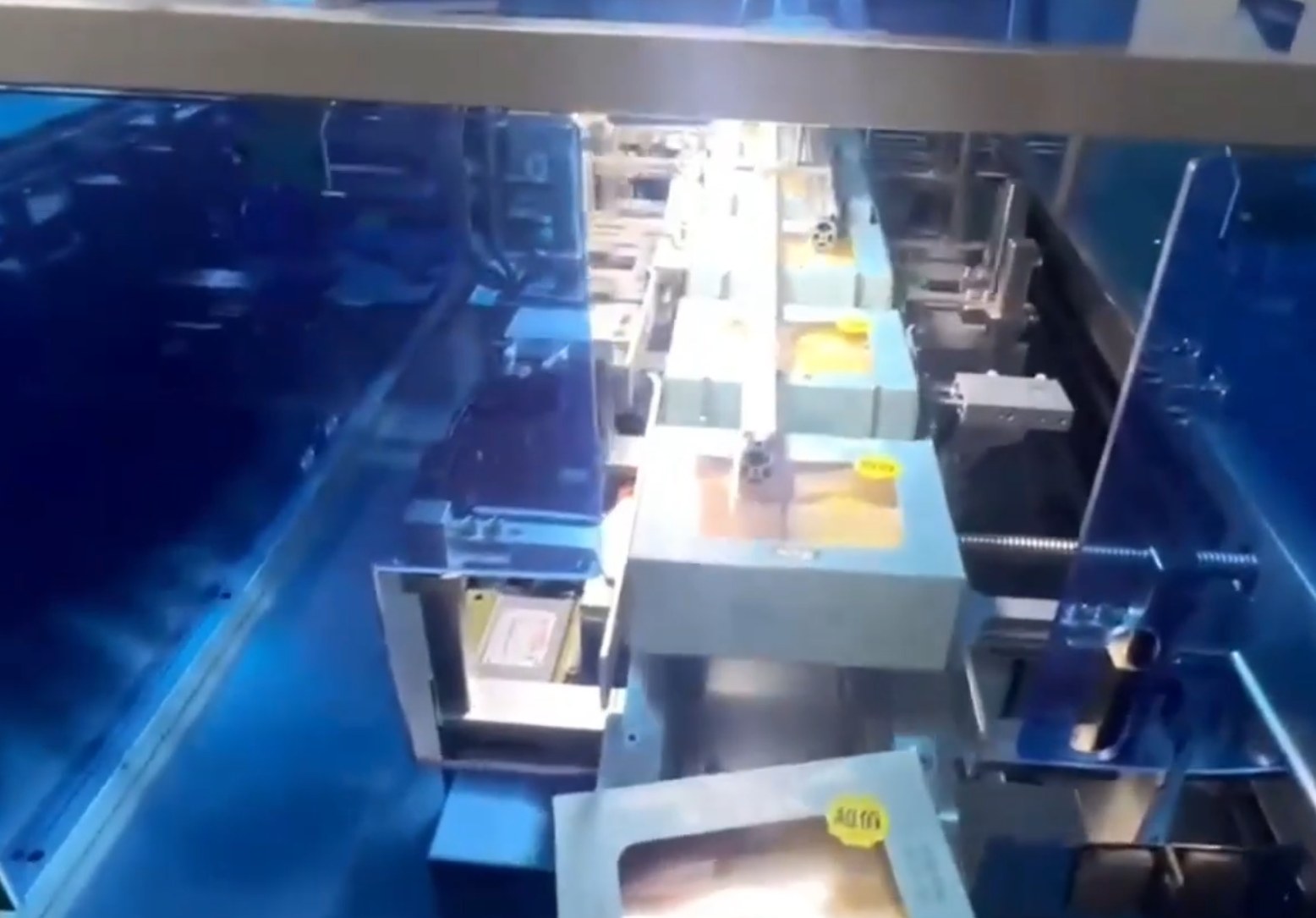 Food cartoning machine in operation, automatically packaging products into cartons on a high-speed production line