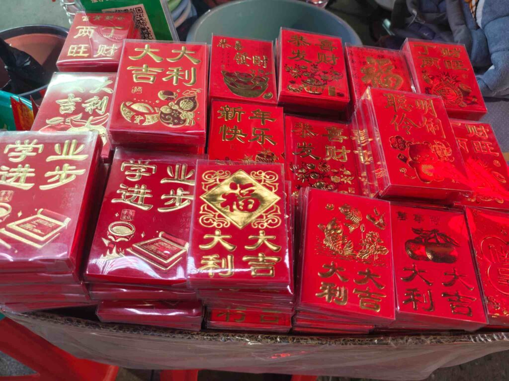 UBL T-type automatic horizontal bagging machine for high-speed red envelope and greeting card packaging.