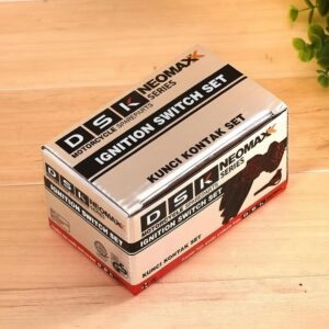 Horizontal cartoning machine packaged DSK NEOMAXX Series Motorcycle Ignition Switch Set, finished hardware component box displayed on wooden surface