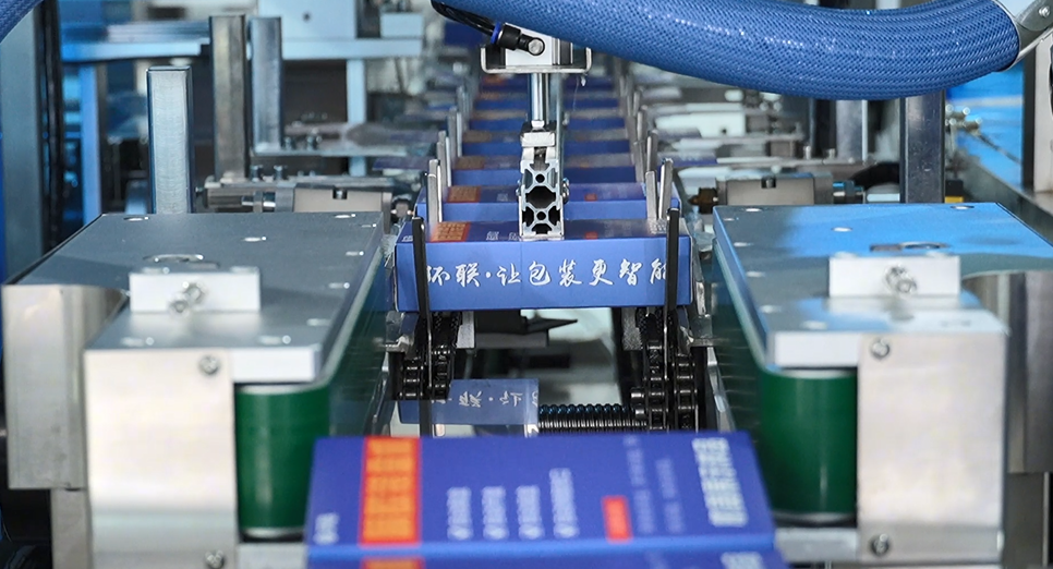 UBL HL-ZC-G1 Servo Tuck End Box Cartoning Machine is discharging the packaged freeze-dried pet food strips.