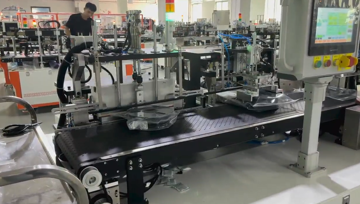 UBL semi-automatic filament packing line for 3D printing filament manufacturers. Real-time footage showing automatic bagging and vacuum sealing process to protect filament from moisture.
