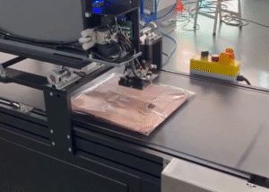 UBL automatic garment folding machine folds, packs, and labels T-shirts in one seamless process for efficient e-commerce order fulfillment