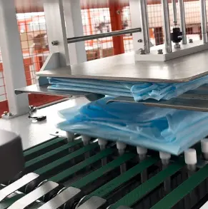 UBL automatic garment folding and stacking system neatly stacks folded protective suits, ready for bagging and packaging