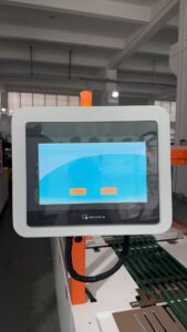 WEINVIEW touchscreen HMI control panel of a t-shirt folding machine, featuring bilingual Chinese/English interface for intuitive operation of automatic garment folding processes.