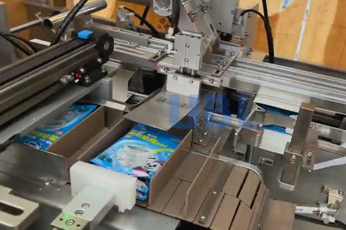 UBL high-speed cartoning machine automatically packaging laundry sheets into boxes, replacing manual labor and boosting production efficiency