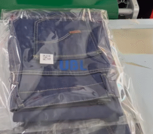 Folded jeans neatly packaged with UBL automatic jeans folding machine, ready for retail