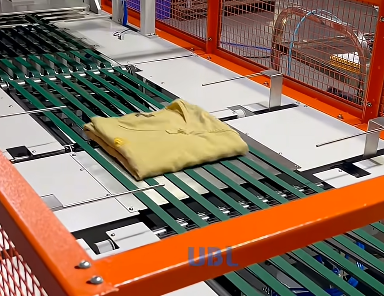 UBL garment folding machine forms compact square folds for bagging, reducing garment length for packaging