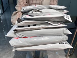 Garment folding machine for e-commerce, automatically folds and bags clothing into poly mailers for fast, consistent online order fulfillment