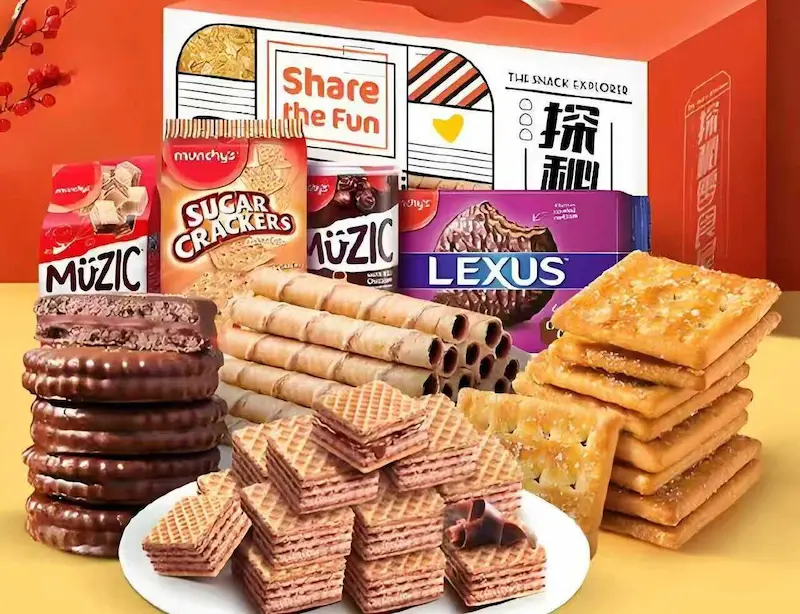 Assortment of food snacks including chocolate cookies, wafers, and sugar crackers, showcasing UBL packaging solutions tailored for the food industry.
