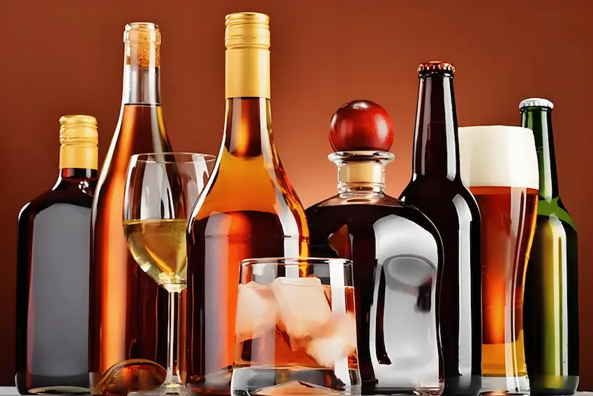 A variety of alcoholic beverages including wine, whiskey, and beer bottles, ready for tailored packaging solutions for the beverage industry by UBL.