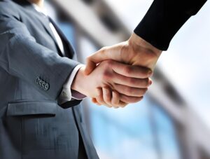 Business handshake partnership image, Contact UBL to cooperate with us and upgrade your food packaging production line with automatic folding & cartoning machines
