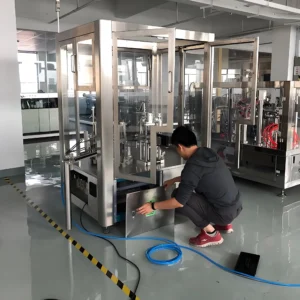 UBL engineer testing and commissioning automatic packaging machine in workshop. Machines can be fully tested before shipment, and on-site commissioning service is available for customers